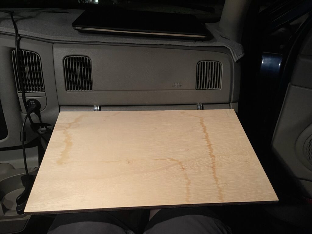 Desk attached to glove box viewed from passenger seat